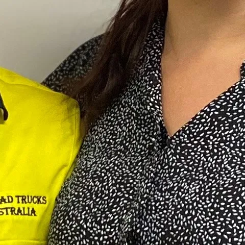 Employers How apprentices and trainees can grow your business Amber young smiling woman apprentice standing with employer looking at viewer in front of company sign indoors clothing human face indoor jeans person posing shoulder sign sleeve smile standing trousers wall woman
