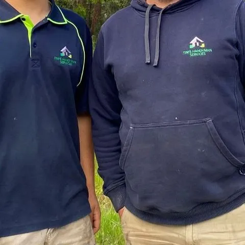 Employers How apprentices and trainees can grow your business Tim apprentice and employer standing looking at viewer outside bermuda shorts clothing grass hiking human face man outdoor person plant polo shirt posing shorts sleeve smile standing t-shirt tree
