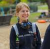 smiling woman in trade gear outdoors