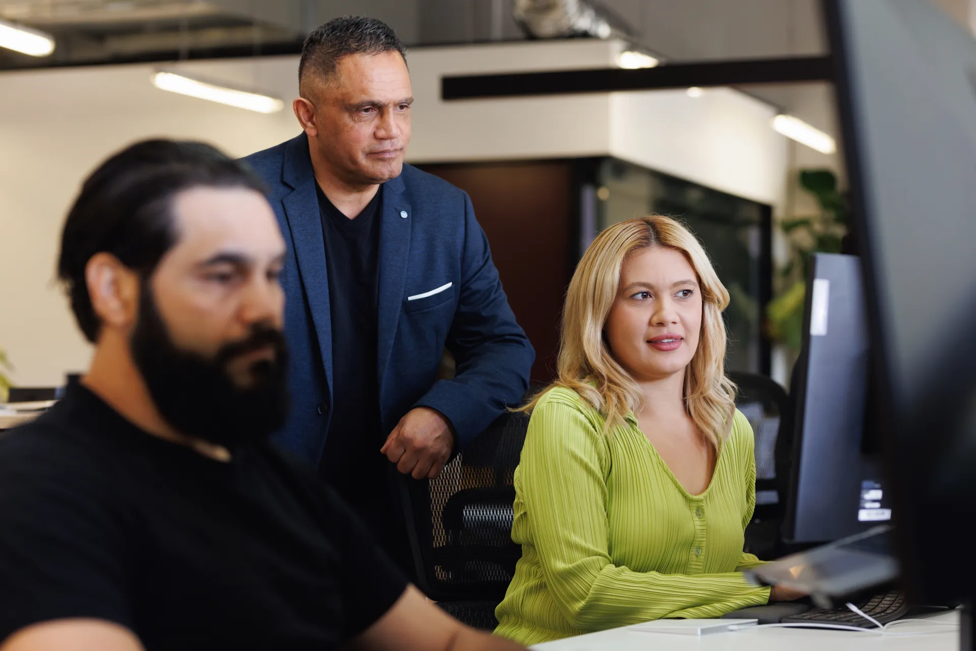 office colleagues man and woman looking at computer screen indoors business bank Recruitment Management Services clothing computer employment human face indoor job man office building person smile wall case study industry partners apprentices employers rms anz